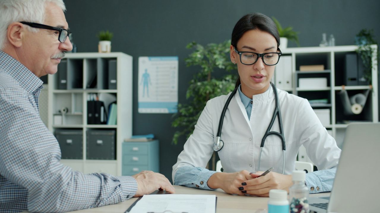 Doctor consulting with an elderly patient